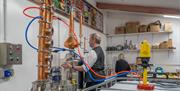 Owners Andy and Zoe at Work at Make Your Own Gin Experience at Shed 1 Distillery in Ulverston, Cumbria