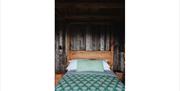 Double bed at Silva Treehouse at Into the Woods near Little Salkeld, Cumbria