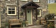 Exterior and Outdoor Seating at Spring Cottage at Helm Mount Lodge & Cottages in Barrows Green, Cumbria