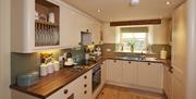 Kitchen in Spring Cottage at Helm Mount Lodge & Cottages in Barrows Green, Cumbria