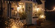 Cottage exterior with festive decorations at Storrs Gate House in Bowness-on-Windermere, Lake District