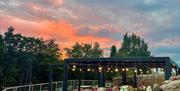 Sunset over Outside Seating at TJ's Bar and Restaurant at Park Foot Holiday Park in Pooley Bridge, Lake District