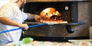 Staff Cooking Pizzas at Ambleside Tap Yard in Ambleside, Lake District