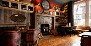 Dining room seating and fireplace at The Ambleside Inn in Ambleside, Lake District
