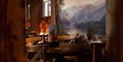 Dining room seating and painting at The Ambleside Inn in Ambleside, Lake District