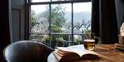 Dining room seating and scenic views at The Angel Inn in Bowness-on-Windermere, Lake District
