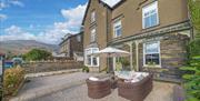 Exterior and outdoor seating at The Apartments Coniston in the Lake District, Cumbria