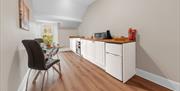 Kitchenette and dining table at The Apartments Coniston in the Lake District, Cumbria