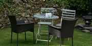 Outdoor Seating at The Coaches Cottage at Abbey Coach House Cottages in Windermere, Lake District