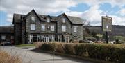 Exterior and signage at The Coniston Inn, Coniston, Lake District