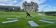 Yoga on the grounds at The Hub at The Heaning Estate in Windermere, Lake District