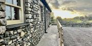 Exterior Ramped Entrance with Sunset at The Old Piggery at Helm Mount Cottages near Kendal, Cumbria