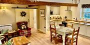 Open plan kitchen, dining, and living area at The Old Piggery at Helm Mount Cottages near Kendal, Cumbria