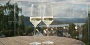 Two champagne flutes overlooking the lake at The Ro Hotel in Bowness-on-Windermere, Lake District