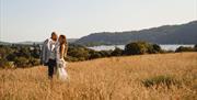 Bridal Couple posing for portraits at a Wedding at The Ro Hotel in Bowness-on-Windermere, Lake District