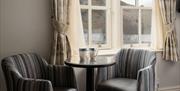 Bedroom seating with a view of Ullswater at The Ullswater Inn in Glenridding, Lake District