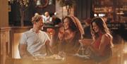 Visitors enjoying drinks at The Ullswater Inn in Glenridding, Lake District