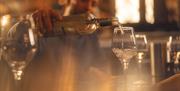 Server pouring wine at The Ullswater Inn in Glenridding, Lake District