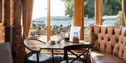 Indoor seating with a lake view at The Wateredge Inn in Ambleside, Lake District