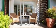 Seating outside a bedroom at The Wateredge Inn in Ambleside, Lake District