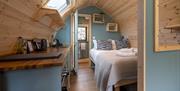 Bed and Kitchenette in a Pod at The Yan Glamping in Grasmere, Lake District