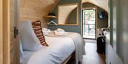 Bedroom and interior of a pod at The Yan Glamping in Grasmere, Lake District
