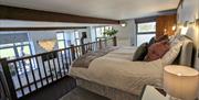 Superking bed on mezzanine at The Dairy at Brackenthwaite Farm near Arnside, Cumbria