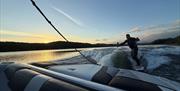 Visitor on a wakeboarding experience with Wake District on Lake Windermere in the Lake District, Cumbria