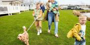 Family with dog at Lakeland Leisure Park in Flookburgh, Cumbria
