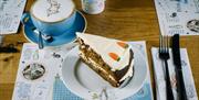 Coffee and carrot cake at the Peter Rabbit Café at The World of Beatrix Potter in Bowness-on-Windermere, Lake District