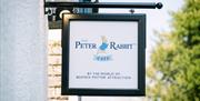 Sign for the Peter Rabbit Café at The World of Beatrix Potter in Bowness-on-Windermere, Lake District