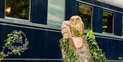 Decorative Wood Carvings of Owls at Bassenthwaite Lake Station & Carriage Cafe in Bassenthwaite Lake, Lake District