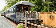 Exterior and Balcony of The Carriage Cafe at Bassenthwaite Lake Station & Carriage Cafe in Bassenthwaite Lake, Lake District