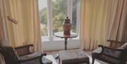 Bedroom seating and scenic view at Ambleside Manor Vegetarian Guest House in Ambleside, Lake District