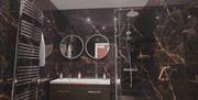 Ensuite bathroom with shower at Ambleside Manor Vegetarian Guest House in Ambleside, Lake District