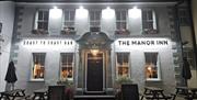 Exterior and outside seating at The Manor Inn in St Bees, Cumbria