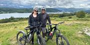 Couple on a guided cycle tour with EMBR Adventures in the Lake District, Cumbria