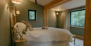 King size bedroom in Luna Treehouse at Into the Woods near Little Salkeld, Cumbria