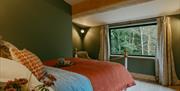 King size bedroom in Luna Treehouse at Into the Woods near Little Salkeld, Cumbria