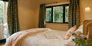 King size bedroom in Luna Treehouse at Into the Woods near Little Salkeld, Cumbria