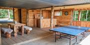 Table tennis and outdoor seating and bar at Silva Treehouse at Into the Woods near Little Salkeld, Cumbria