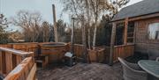Deck and hot tub at Silva Treehouse at Into the Woods near Little Salkeld, Cumbria
