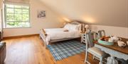 Double bed and dining table at Ellenboro House in Newton-in-Cartmel, Lake District