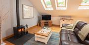Living space with wood burner at Ellenboro House in Newton-in-Cartmel, Lake District