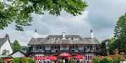 Exterior and outdoor seating at Pooley Bridge Inn in the Lake District, Cumbria