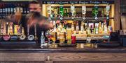 Bar staff working at Pooley Bridge Inn in the Lake District, Cumbria