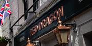 Exterior signage at the Red Dragon Inn in Kirkby Lonsdale, Cumbria