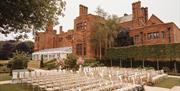 Seating arranged on the grounds for an outdoor wedding at Abbey House Hotel & Gardens in Barrow-in-Furness, Cumbria