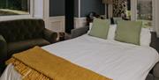 Sofa bed in living room at The Pheasant Lodge near Grange-over-Sands, Cumbria