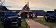 Vehicles and bell tent set up for an event at Graythwaite Adventure in the Lake District, Cumbria